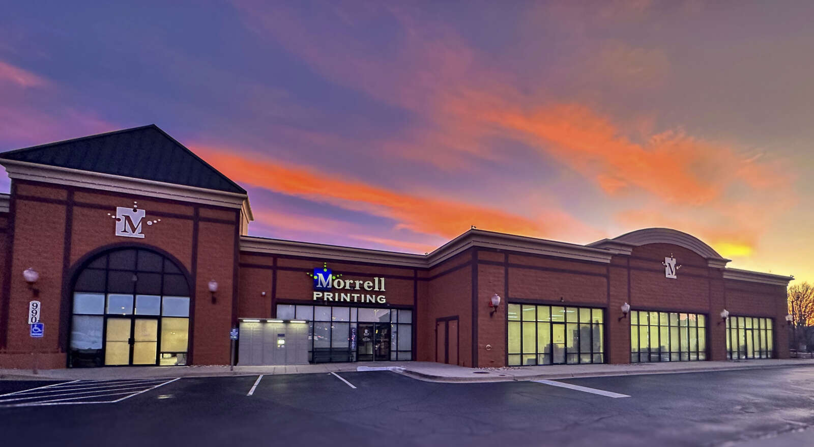 Morrell Printing building with sunset and clouds
